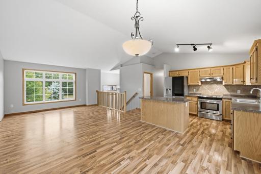 Open kitchen flows into dining and living space