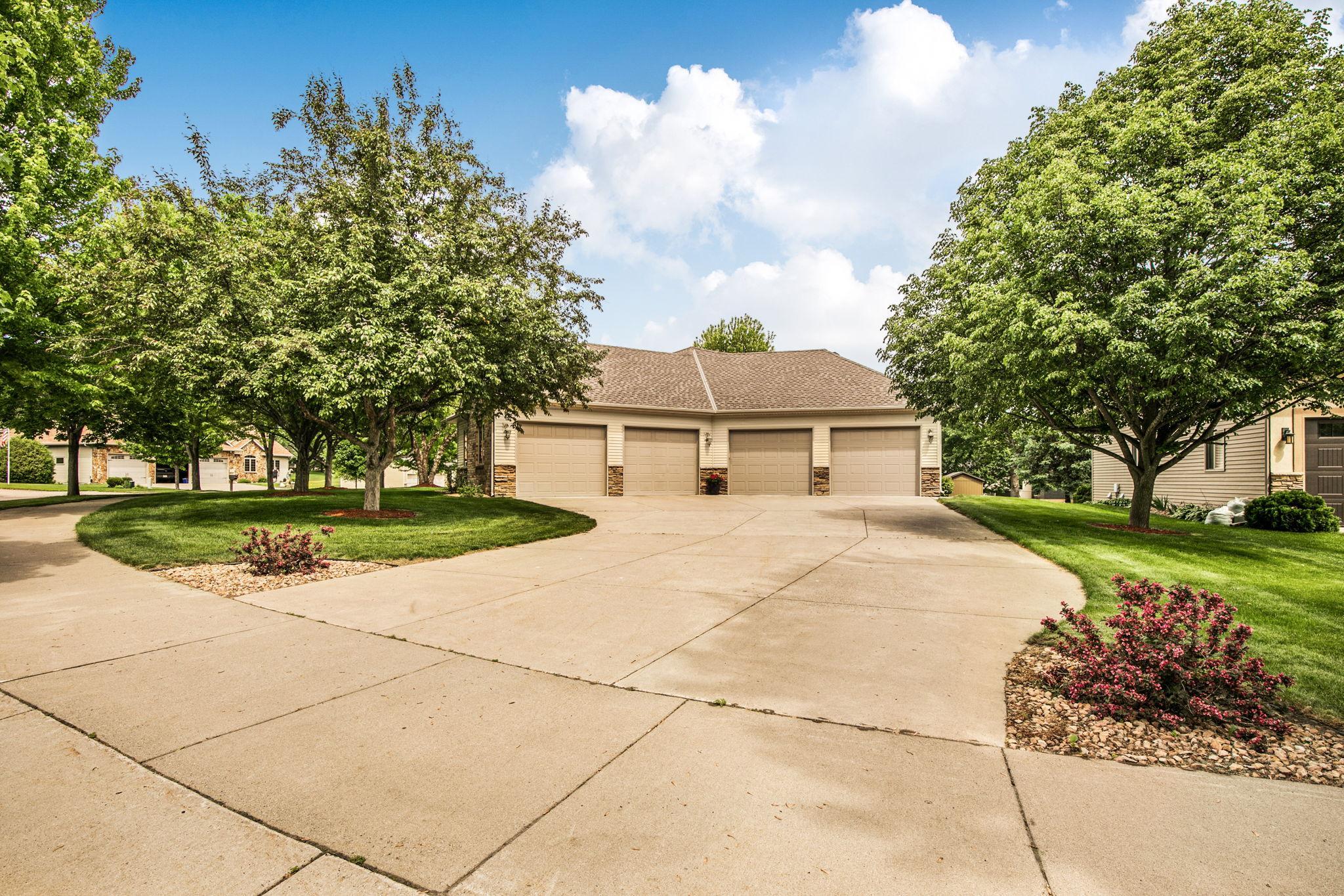 Driveway accommodates multiple vehicles.