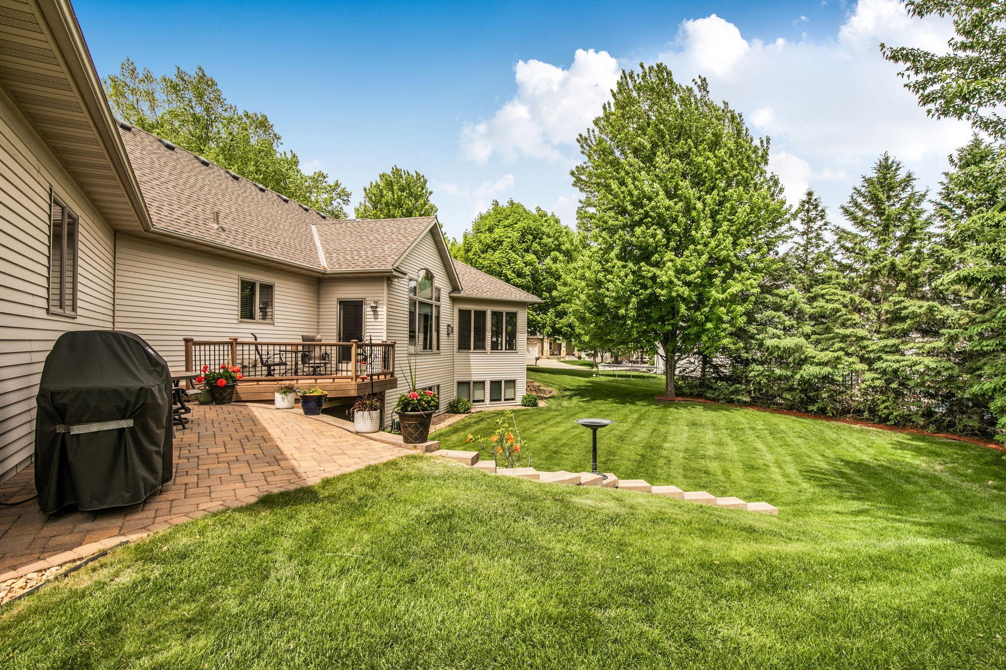 Patio off of the deck creates another outdoor living space.