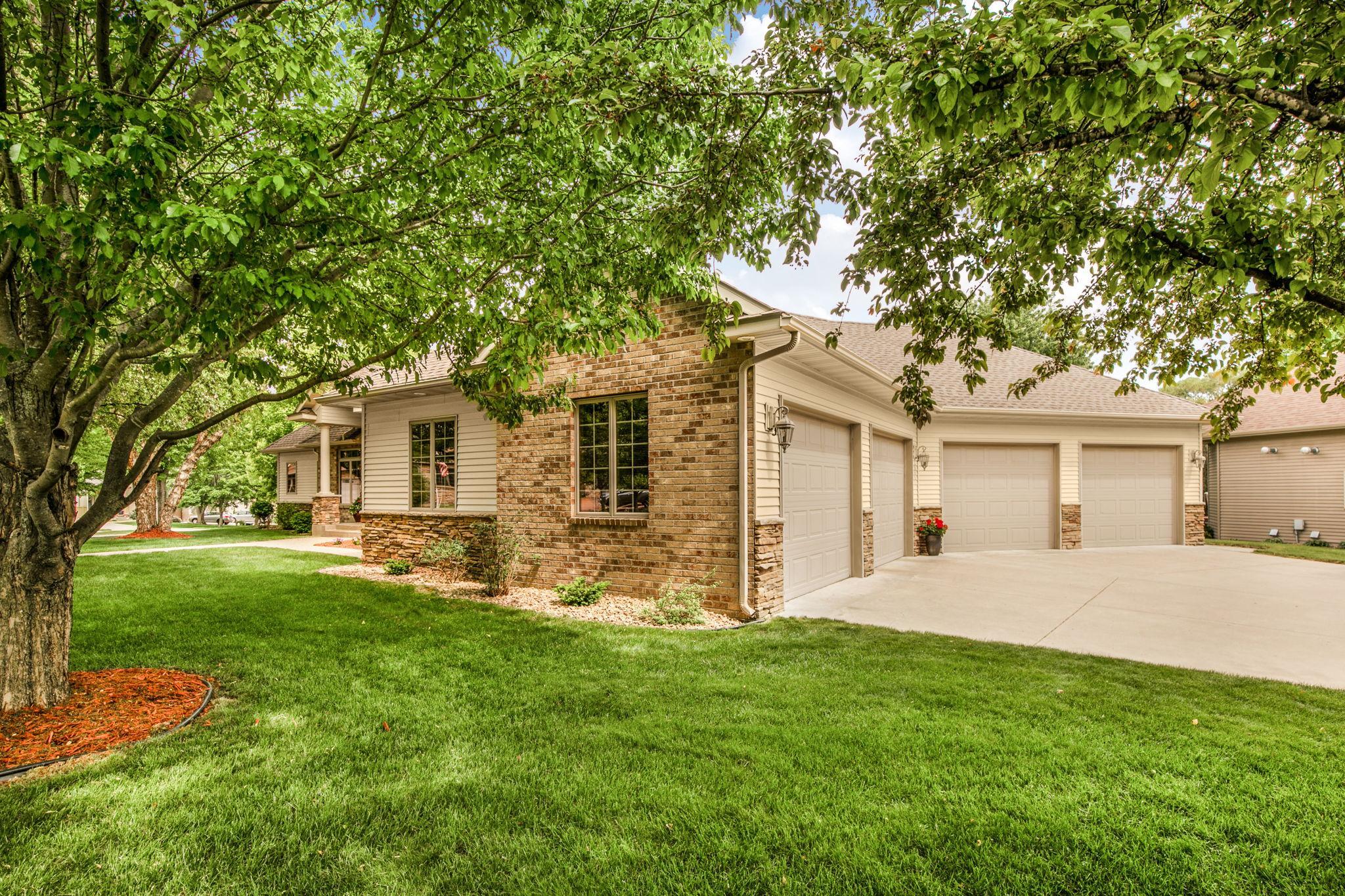 Lush landscaping blends seamlessly with the surrounding natural environment.