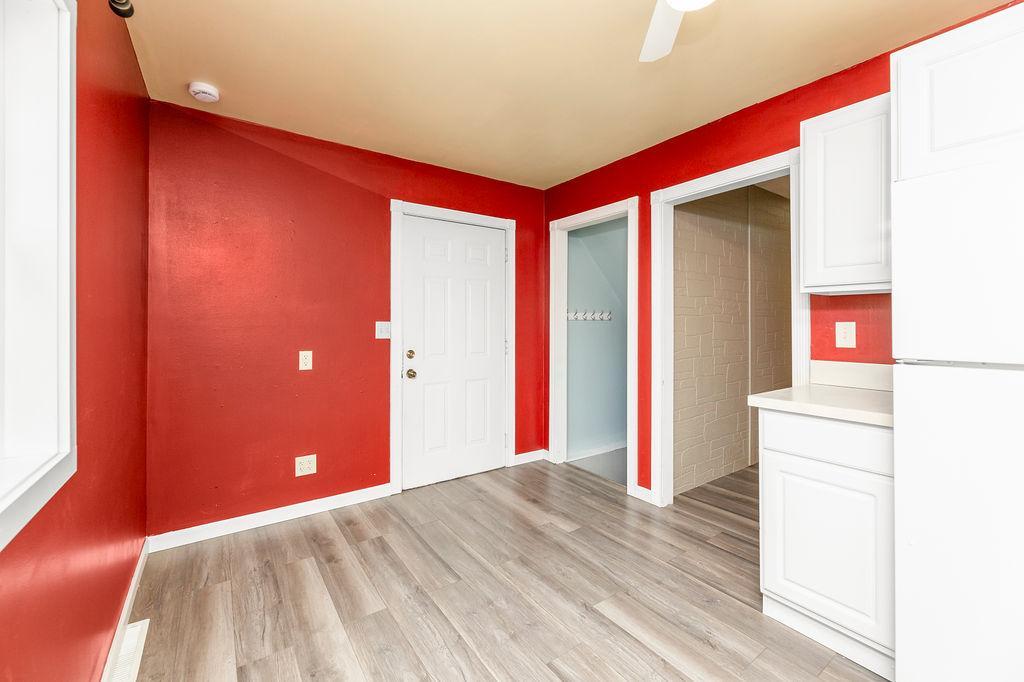 Cute & cozy eat-in kitchen with Garage entry & stairs to basement