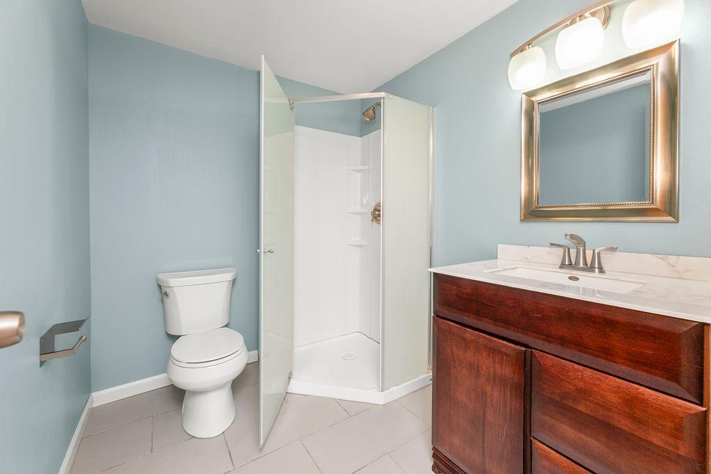Tile floors, newer vanity, newer shower