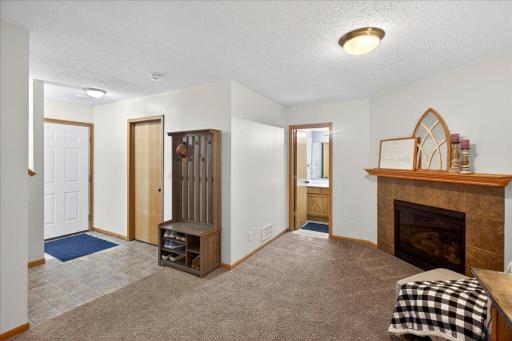 Step inside to a warm and inviting family room where cozy evenings by the fireplace and comfortable gatherings come naturally.