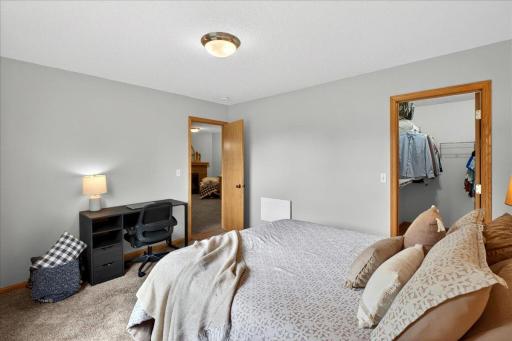 Generous proportions and easy access to the adjacent bath create a comfortable and private living space.