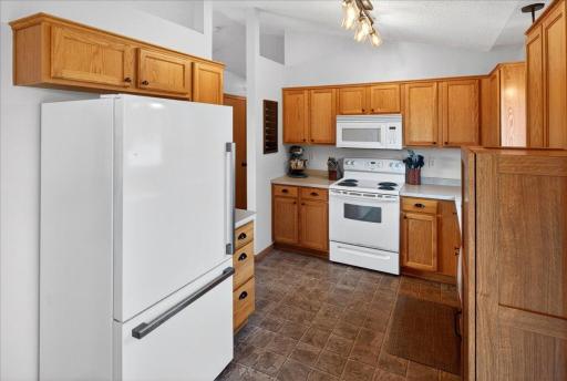 Thoughtfully designed for functionality, the kitchen keeps everything within reach while staying connected to the home's main living areas.