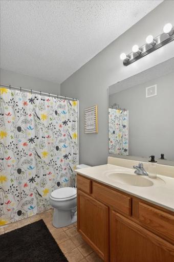 This upper-level full bath offers plenty of space to support busy mornings and a busy households.