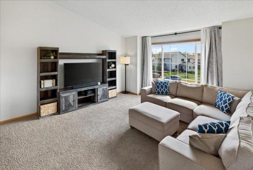 Filled with natural light and generous space, the living room offers the perfect place to gather, relax, and enjoy everyday moments.