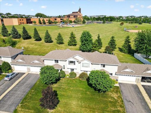 A rare setting with sweeping green space behind the home, creating a sense of privacy and openness that's hard to find.