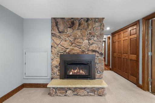 Lower level fireplace continues the comfort.