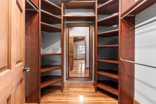 Custom designed walk in closet with ample storage for the fashion enthusiast.