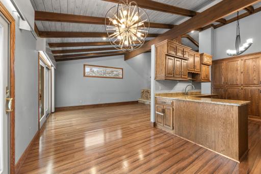 Dining area positioned between living and kitchen space for effortless entertaining.
