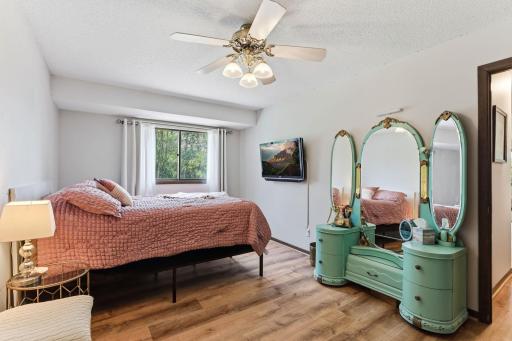 Very spacious primary bedroom with newer flooring.