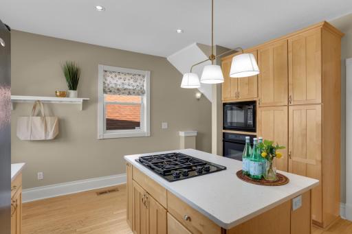 Mudroom nook conveniently located just off the kitchen, with steps the basement located to the right