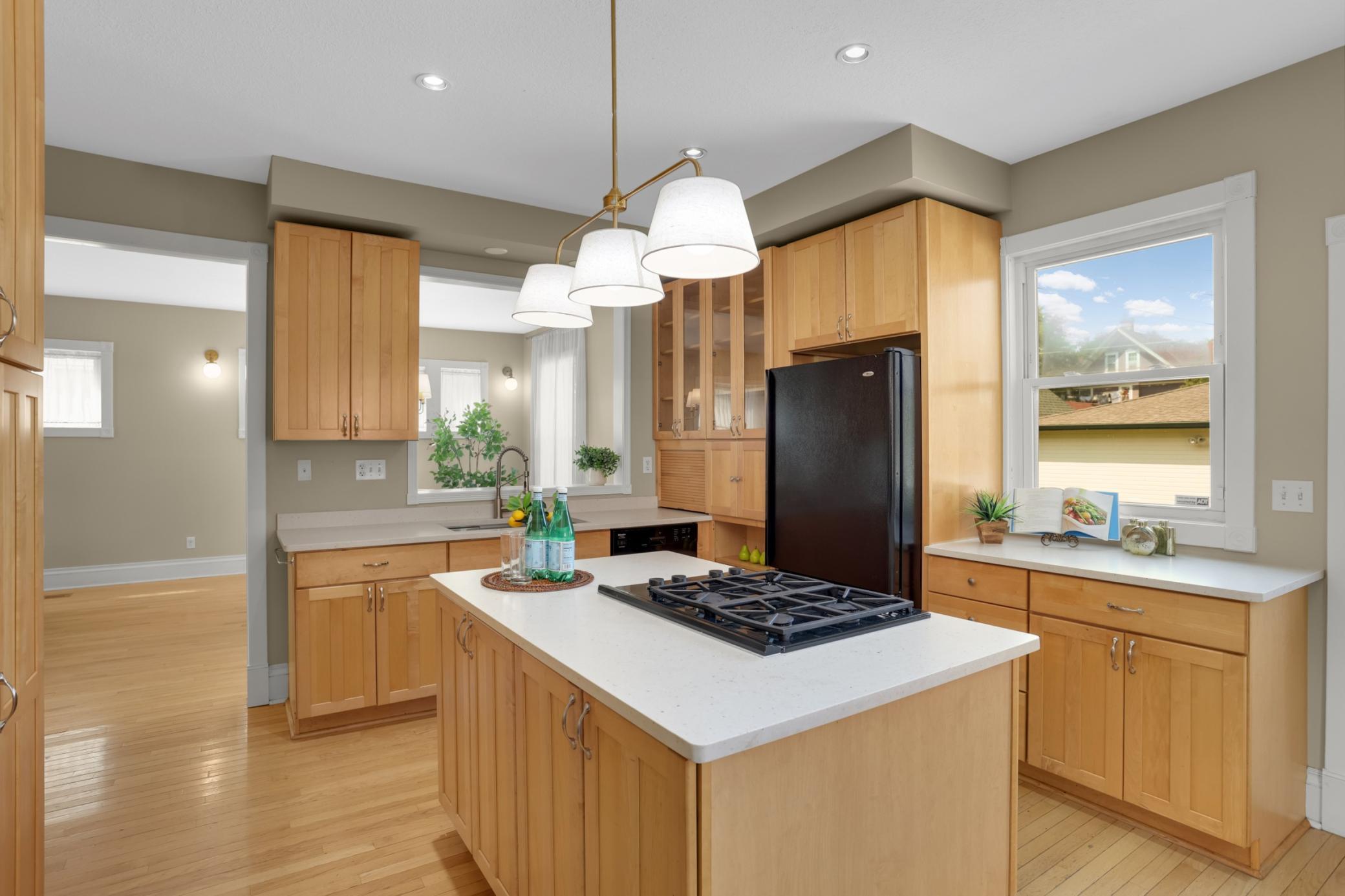 Huge windows throughout offer great light and views of the green backyard.