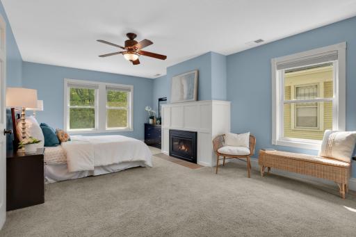 Imagine ending your days in this peaceful primary bedroom, complete with cozy gas fireplace and walk-in closet. Light spills in from all sides.