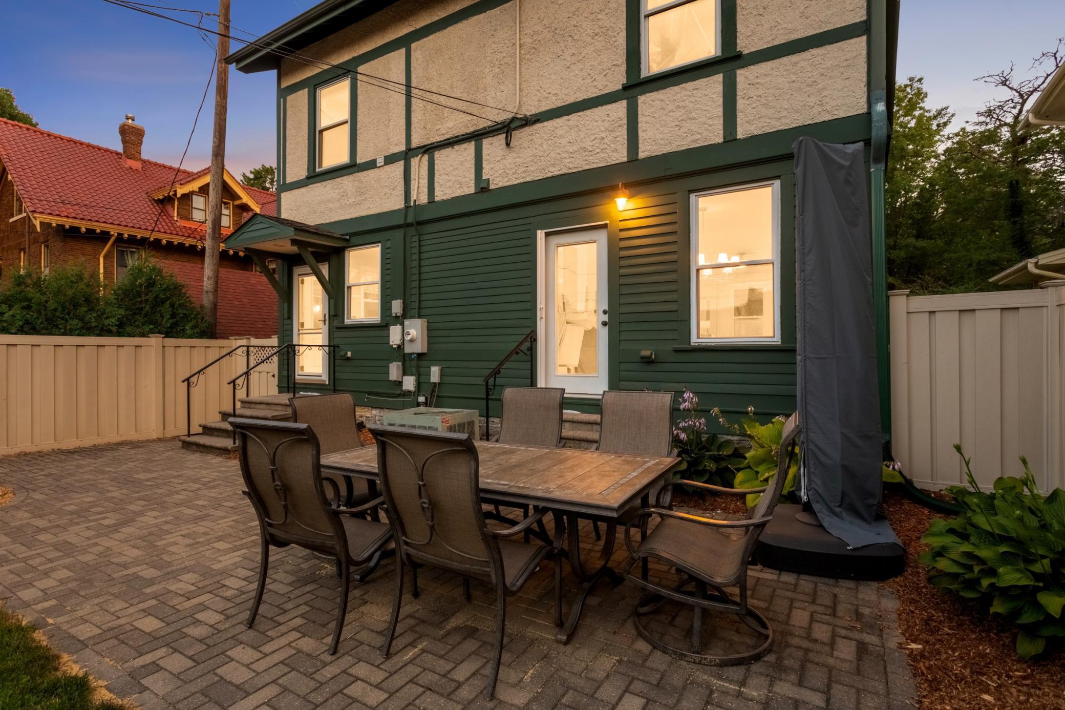 Let's check out the beautiful backyard - featuring a new portico over the back entry and updated landscaping and patio area.