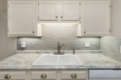 Beautiful Kohler porcelan Sink,Tile Backsplash and Multi-Port Outlet
