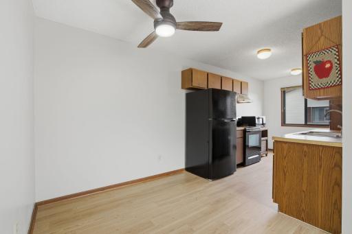 Kitchen and dining room views. Brand new vinyl plank flooring.
