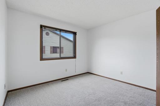 Generous size bedroom 2, new carpet & fresh paint.room.