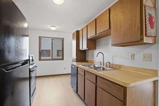 Kitchen view with space for a small eat in kitchen table.