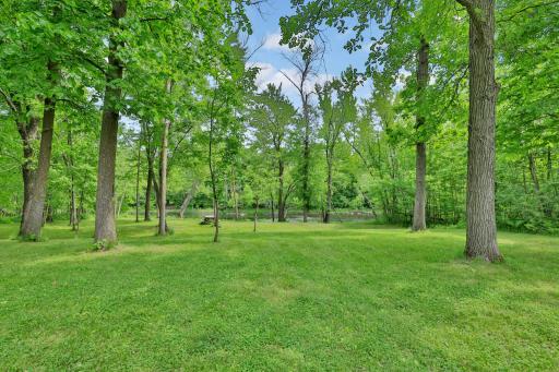 Rare find to have such an amazing huge gently sloping yard down to the river.