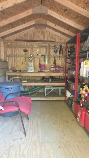 Interior of shed, some items have been removed.