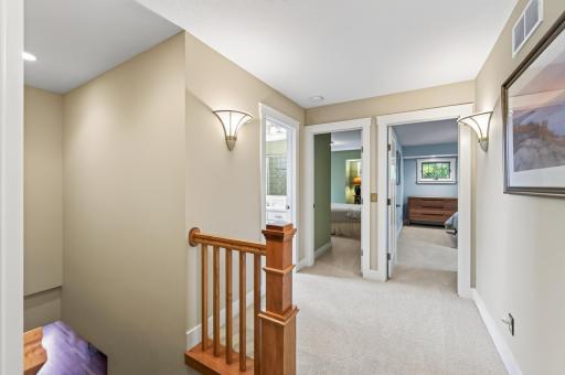 The upper level is thoughtfully designed with three well-appointed bedrooms, creating a peaceful retreat for every member of the household.