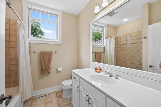 Sun drenched full bathroom on the upper level.