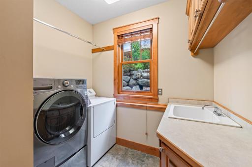 Thoughtfully positioned on the main level, the laundry room offers everyday convenience without compromising the home's timeless design.