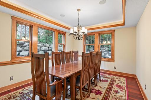A beautifully crafted tray ceiling, paired with statement lighting, adds depth, elegance, and architectural character.