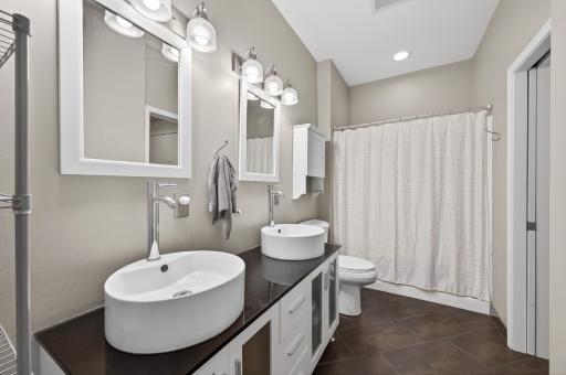 Tastefully appointment bath with dual vanity.