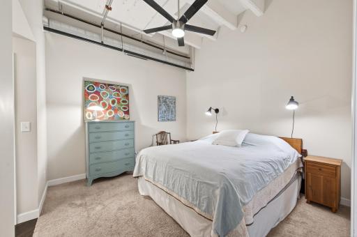 Entering the spacious main bedroom with walk in closet.