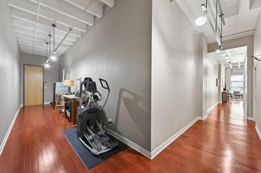 Views from the corner of the unit showing interior entrance and bonus space previously used as an art studio and exercise room.
