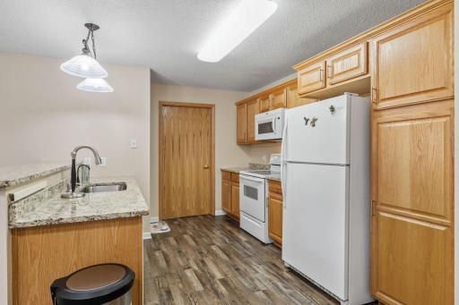 Beautiful updated kitchen with granite counters & new sink and faucet