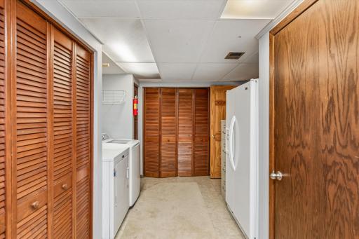Laundry room with an abundance of storage