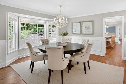 White Enameled Wainscoting in Dining Room - Bay Window, Hardwood Floors, Recessed Lighting