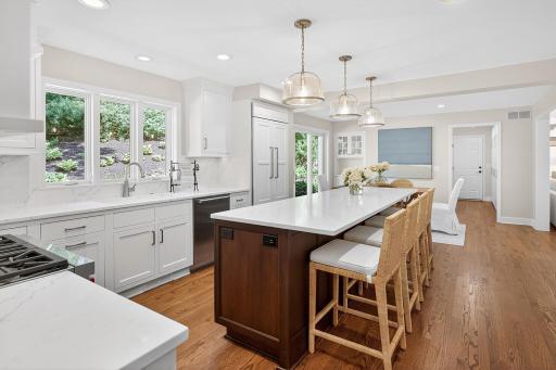 Kitchen Window Overlooks Backyard and Patio, Custom Lighting Over Island