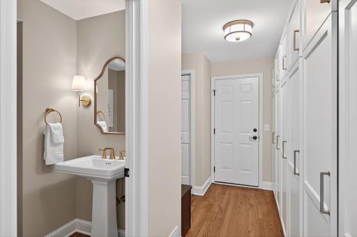 Main Floor Powder Room In Back Hallway Leading from Garage to Kitchen