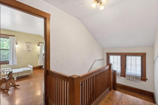 Old windows add light and charm to the staircase.