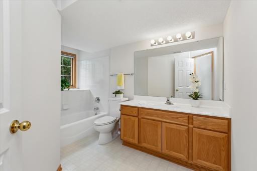 Sparkling clean! Lovely white tile and garden windows!