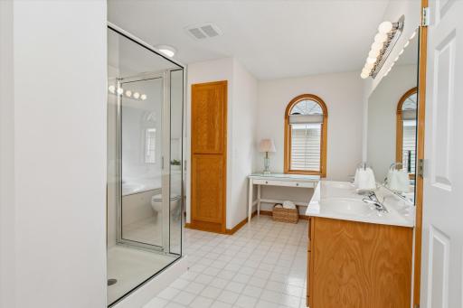 Double sink vanity, shower and soaking tub. Large linen closet plus loads of natural light!
