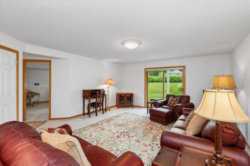 Casual walkout family room. Will work great for movie night and game night! Any number of ways that work best for you!