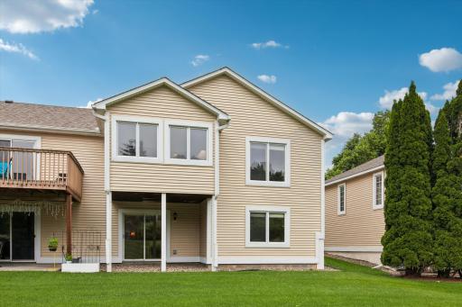 Covered walkout area out back leading to spacious yard!
