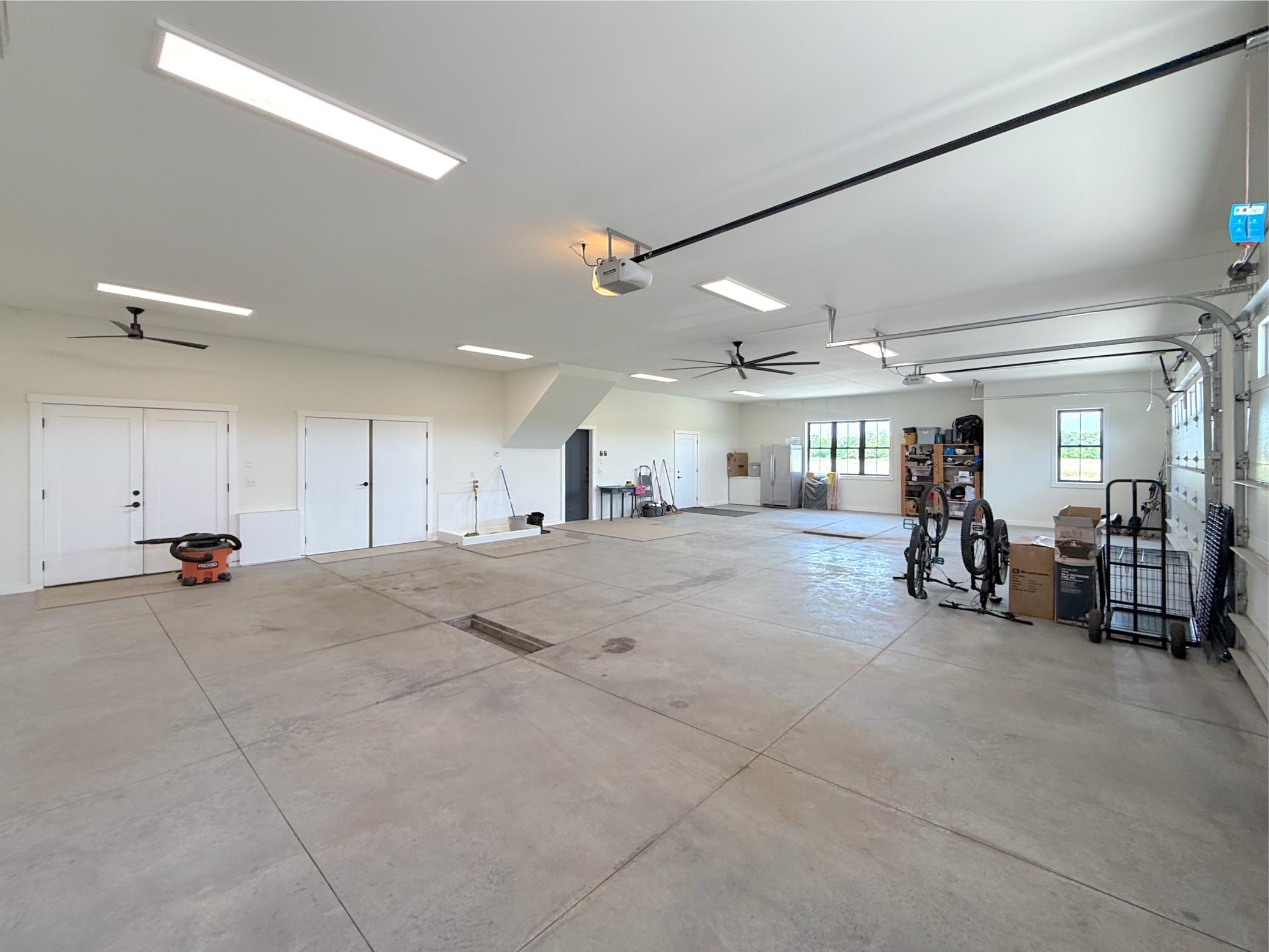 The attached 4-car garage is an exceptional extension of the home, offering abundant space for vehicles, recreational equipment, hobbies, and storage.
