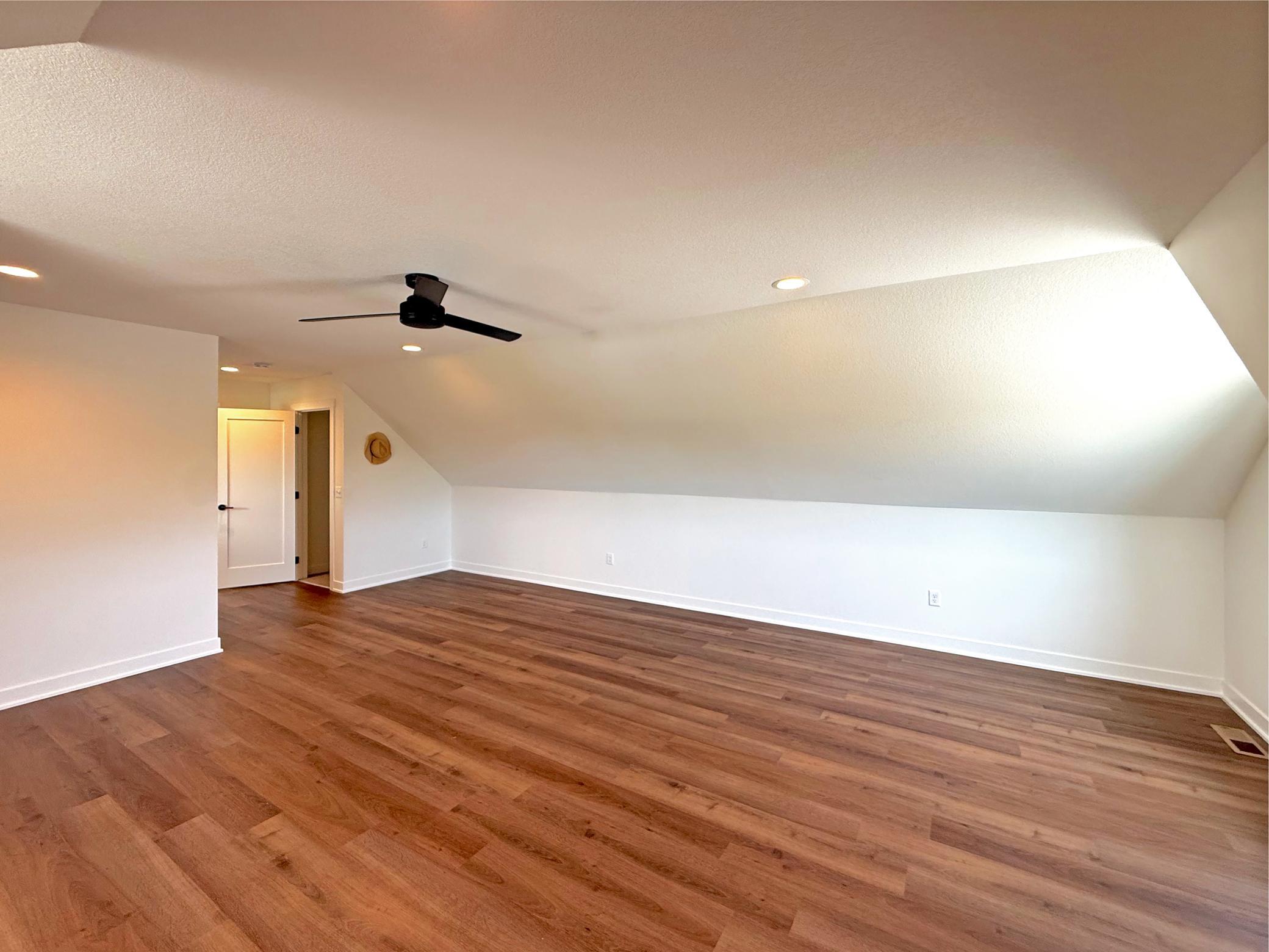 Conveniently located near the upper-level family room and full bath, this bedroom provides privacy and flexibility, making it ideal for overnight guests.