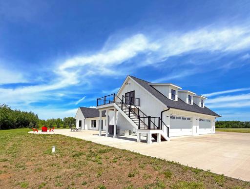 Outside, an extensive concrete apron surrounds the home and attached 4-car garage, providing ample room for vehicles, equipment, and entertaining.