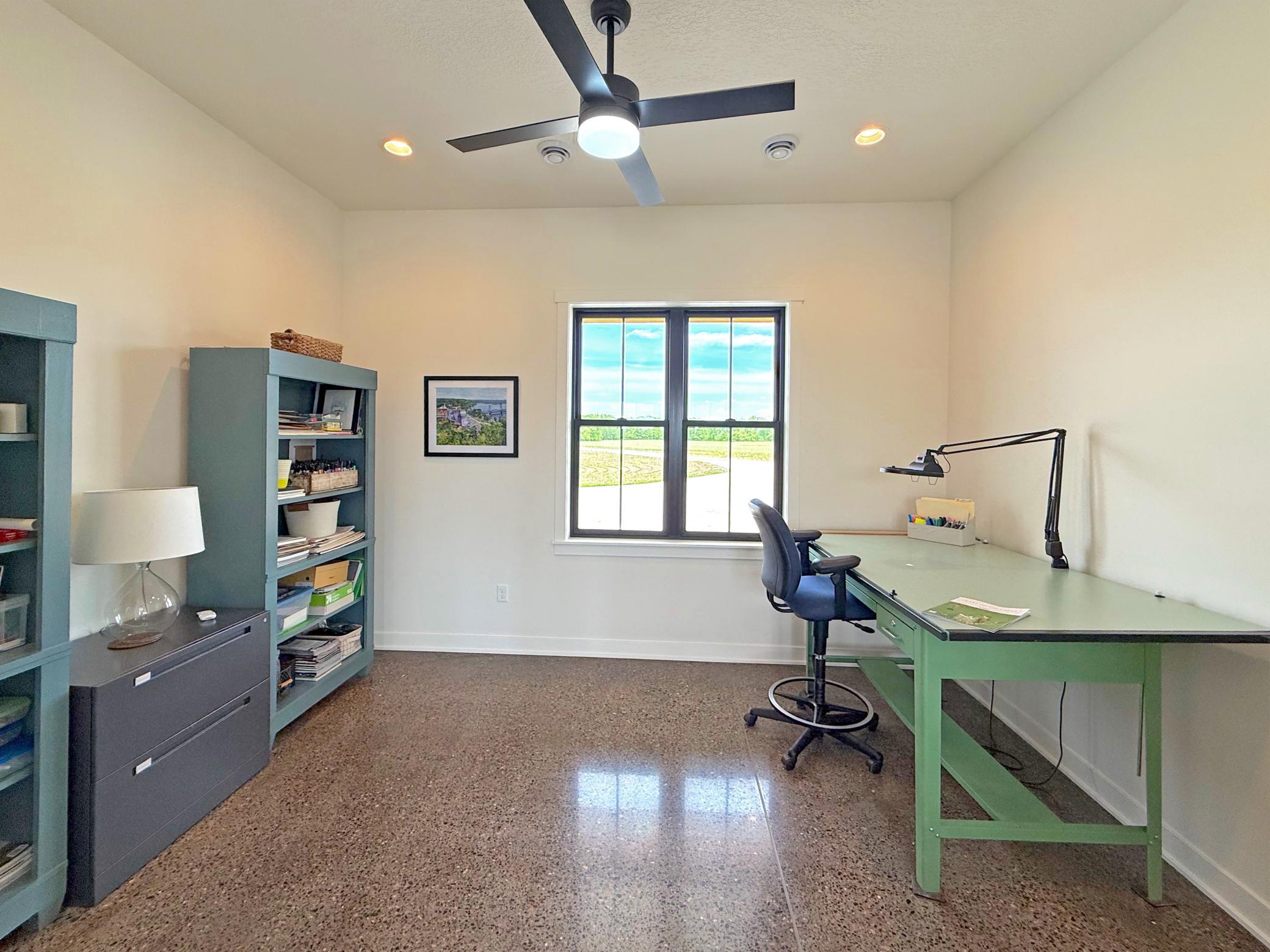 The main-floor office provides a quiet and versatile workspace, complete with elegant French doors and a walk-in closet for exceptional storage.