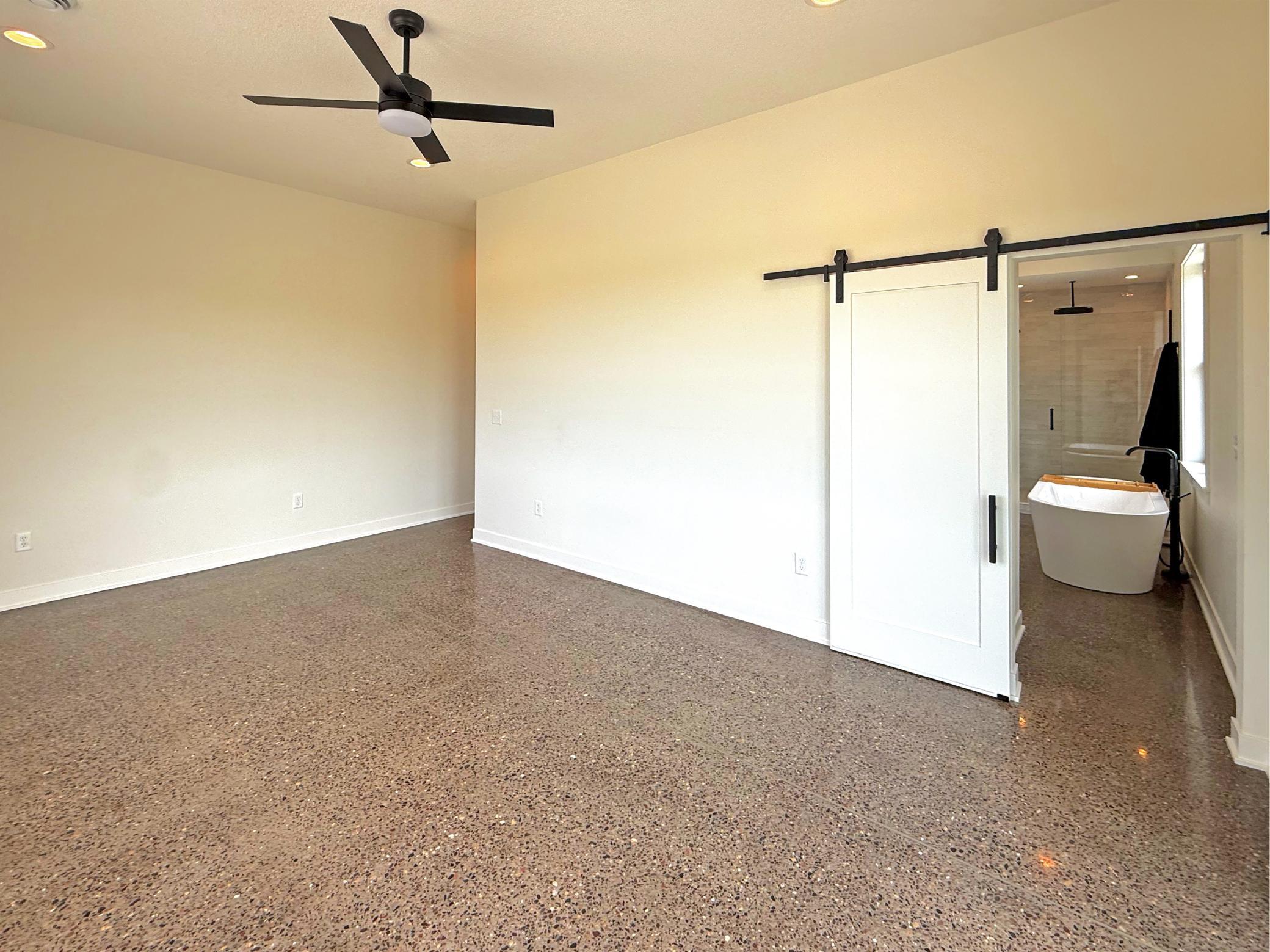 The suite is completed by ceiling fan and a generous walk-in closet, providing exceptional storage and convenience.