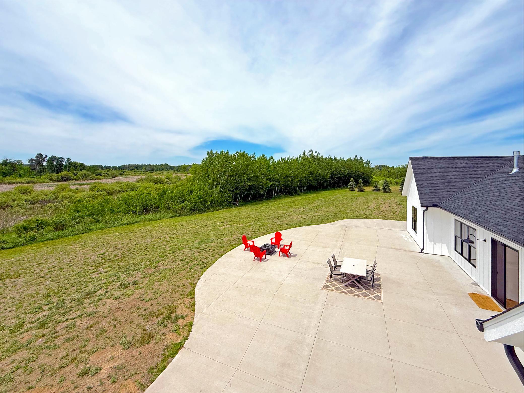 Outdoor entertaining is taken to the next level with an impressive 4,000+ square feet of concrete patio space, providing endless room for gathering.