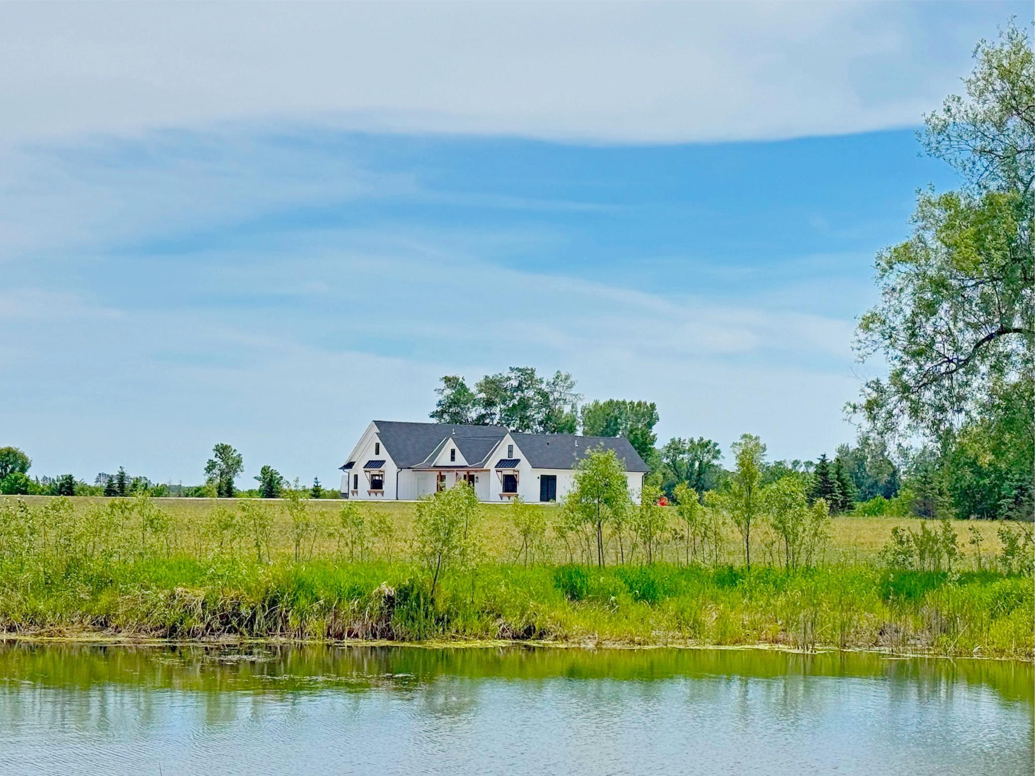 With its blend of custom craftsmanship, modern amenities, expansive acreage, tillable land, scenic ponds, and incredible privacy, this is truly a rare property.